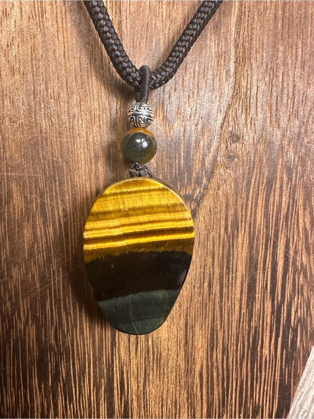 Unique Blue and Golden Tiger’s Eye Skull Carving Pendant Necklace on Brown